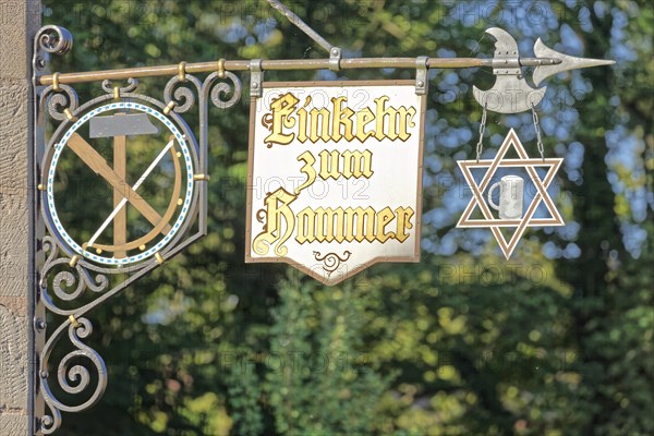 Signboards with inscription Contemplation to hammer Tavern