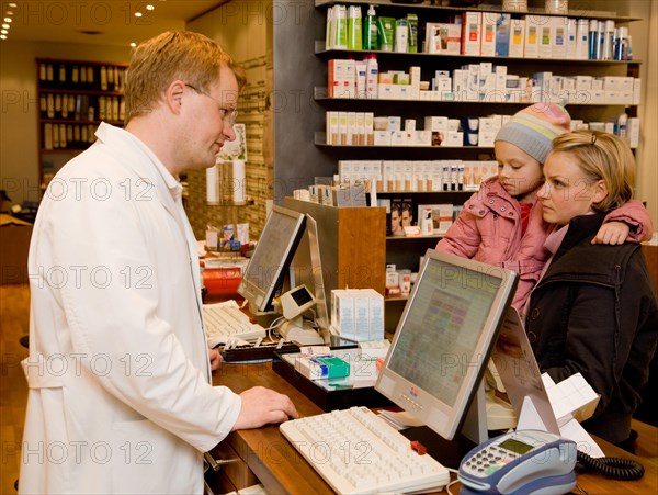 Pharmacist and mother with daughter