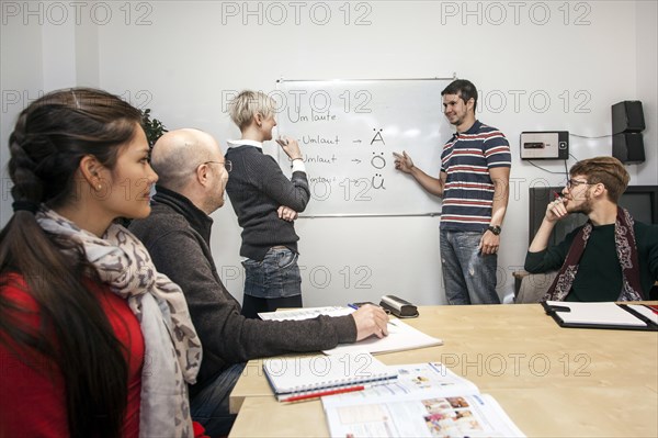 Group of adult students with a teacher