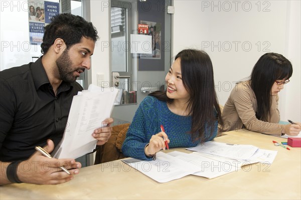 Foreigners in German lessons in an international class