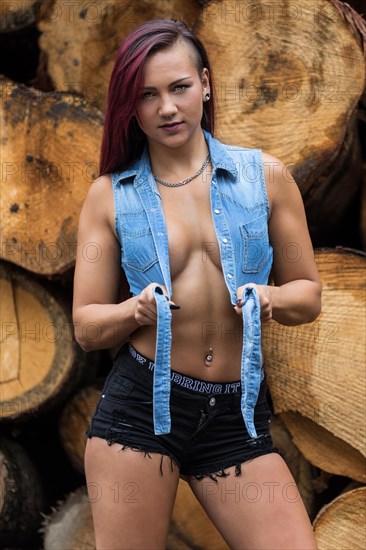 Young woman with jeans jacket and black hotpants