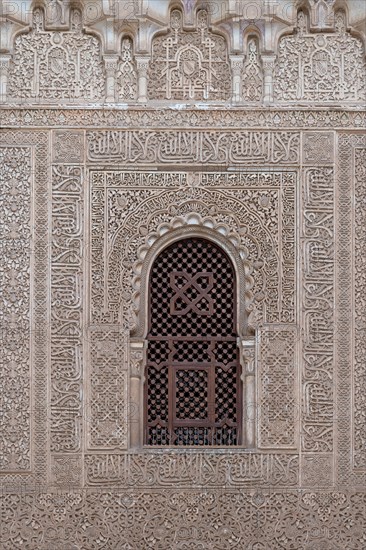 Wall with ornamental Moorish plaster decorations and Koransuren