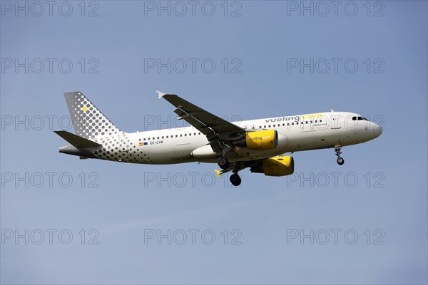 Vueling Airlines A320 Airbus on landing approach to Franz Josef Strauss Airport