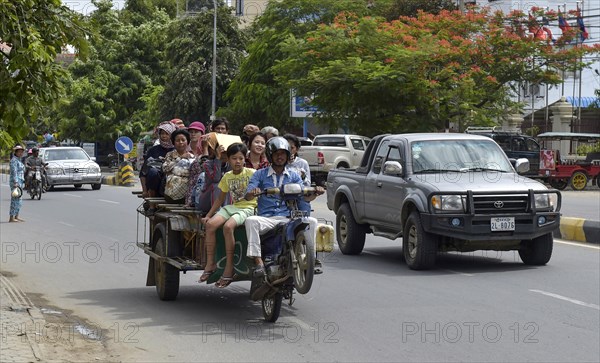 Man on scooter makes a wheelie