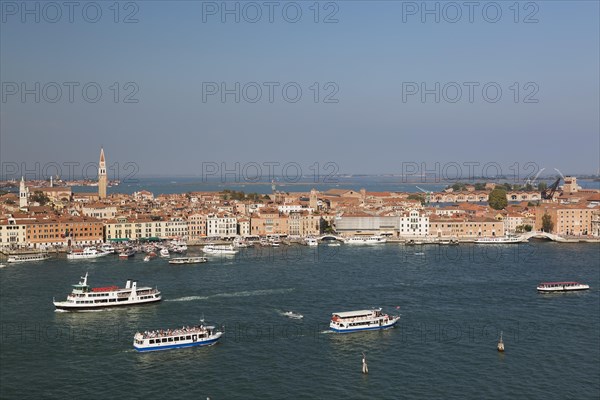 City view with excursion boats and vaporetto in the lagune