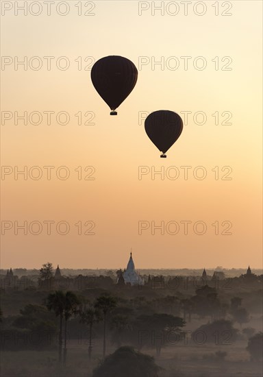 Hot-air Balloons in flight over temples