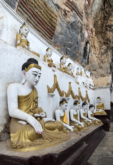 Line of Buddha statues at Kaw-goon