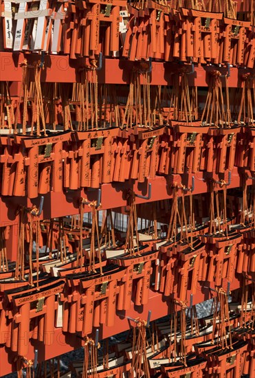 Ema wish plaques in the shape of orange torii gate