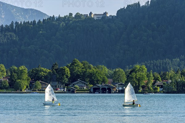 Regatta with children in sailing boats