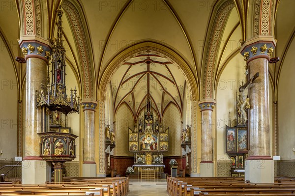 Interior with pulpit and choir of the neo-Gothic parish church of the Assumption