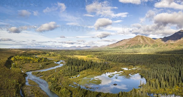 Lake and river in autumnal tundral landscape