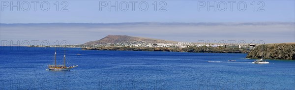 Beaches and Coast with sailing ship and Playa Blanca in the background