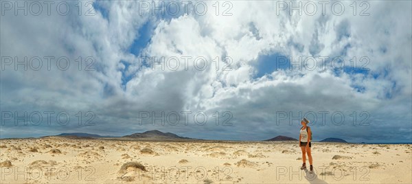 Young woman in the sand dunes at Morros Negros