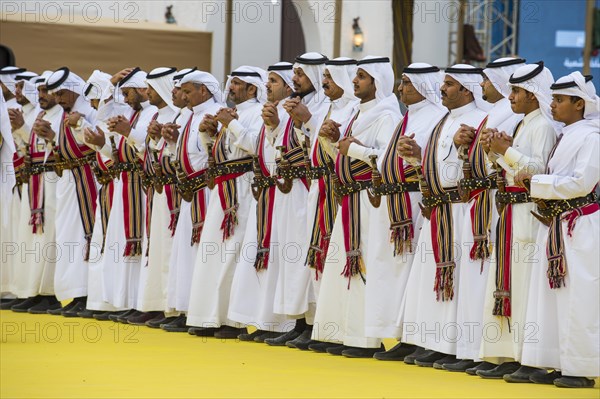 Traditional dressed local men dancing at the Al Janadriyah Festival