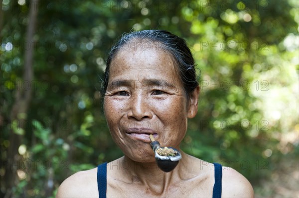 Woman with pipe in mouth