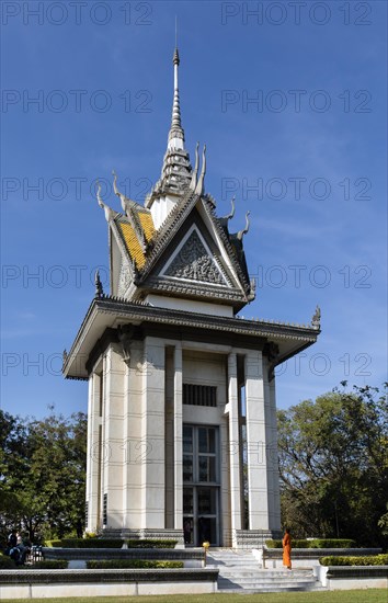 Buddhist monk in front of the Memorial Stupa