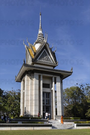 Buddhist monk in front of the Memorial Stupa