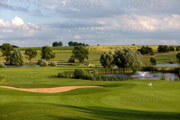 Golf course with water obstacle