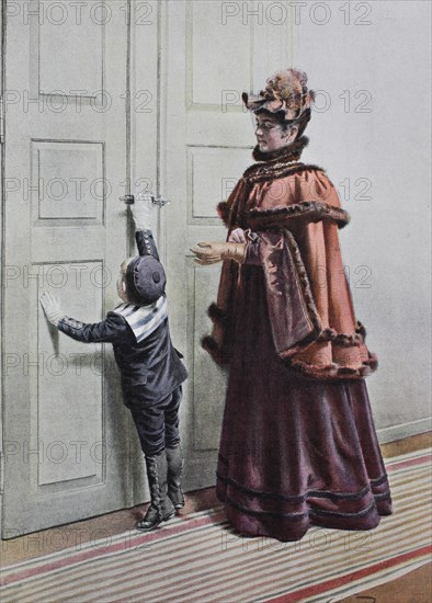 Woman and little boy are standing in front of the door