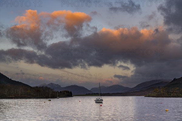 Sailboat with Loch Linnhe at sunrise with coloured clouds