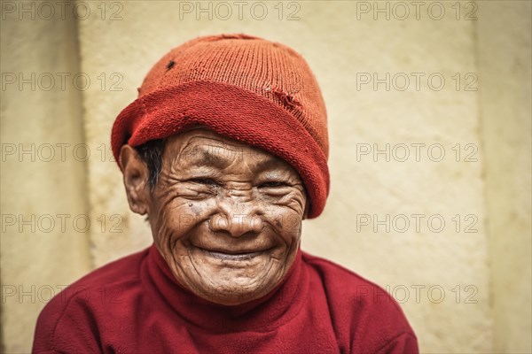 Laughing woman with cap