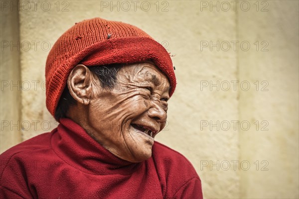 Laughing woman with cap