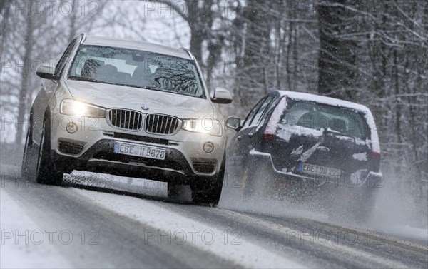 Snowy road with cars