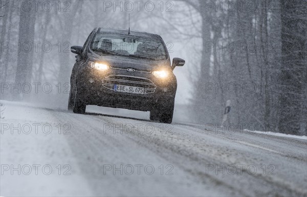 Snowy road with cars