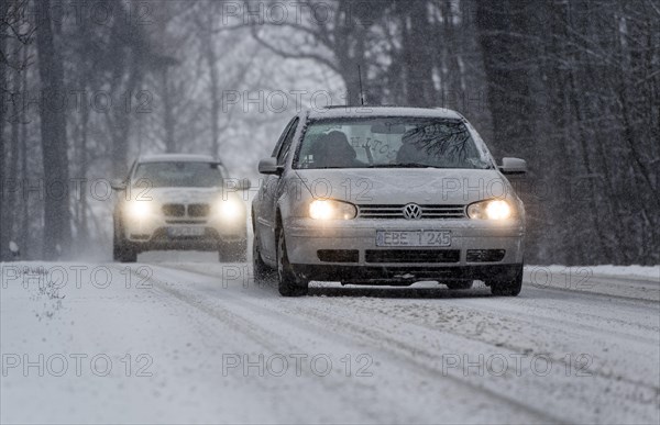 Snowy road with cars