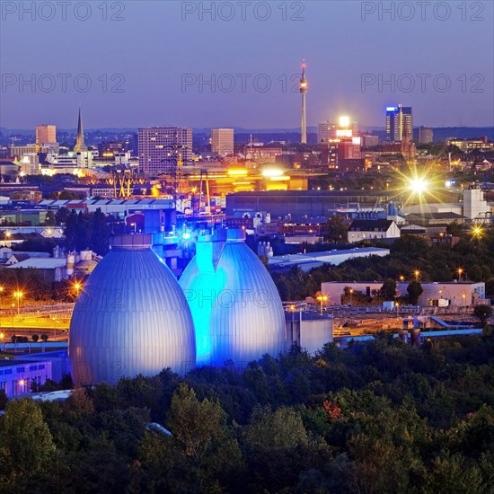 City view with the illuminated digesters of WWTP Dortmund Deusen II