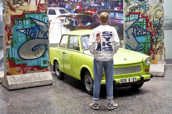 Original Berlin Wall with Trabi and film of the opening of the Berlin Wall in 1989