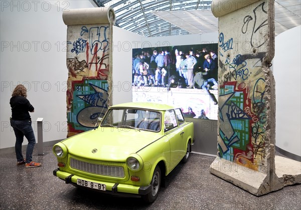 Original Berlin Wall with Trabi and film of the opening of the Berlin Wall in 1989