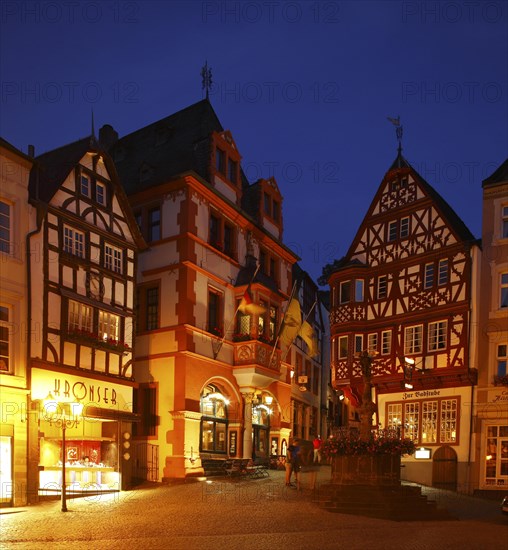 Market place with City Hall and Michael fountain in the historic centre of Bernkastel at dusk