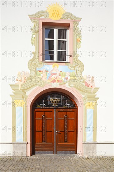 Old wooden door with window