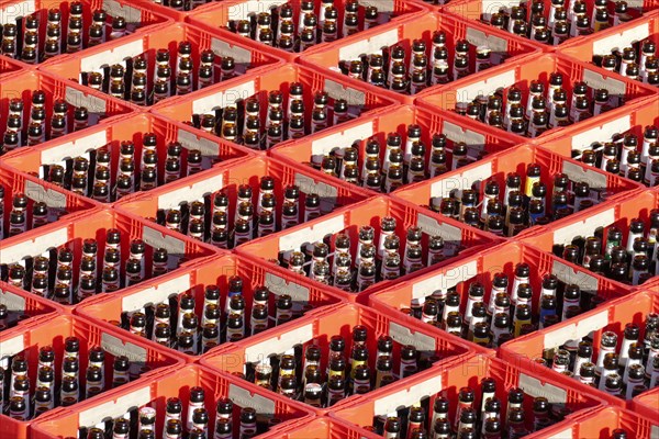 Red beer crates with empty beer bottles