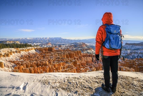 Young woman looking at the amphitheatre at morning light