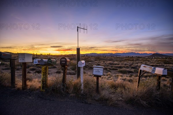 Roadside mailboxes at sunset