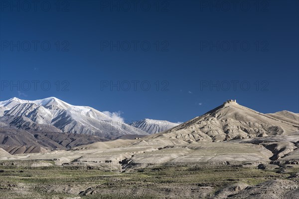 Snowy mountains and ruin