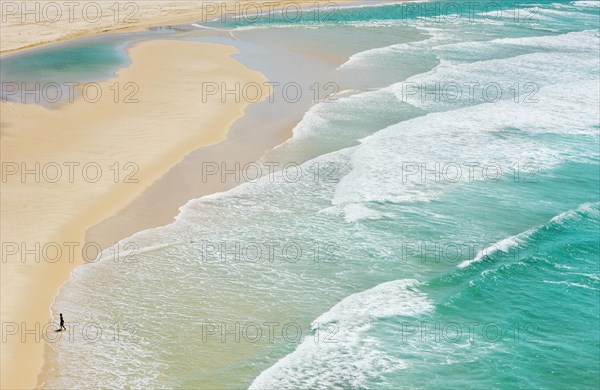 Person walking on Seventy Five Mile Beach