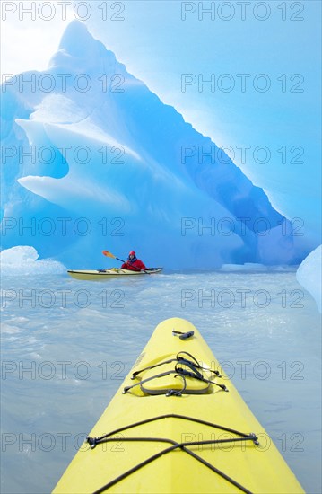 Kayaker heading for icebergs on Lago Grey