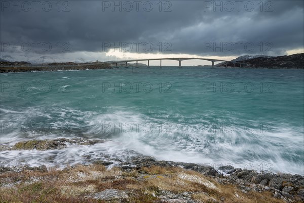 Bad weather and stormy sea with car bridge to Sommaroy