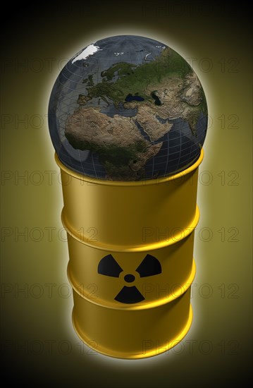 Globe lying on barrel with nuclear waste