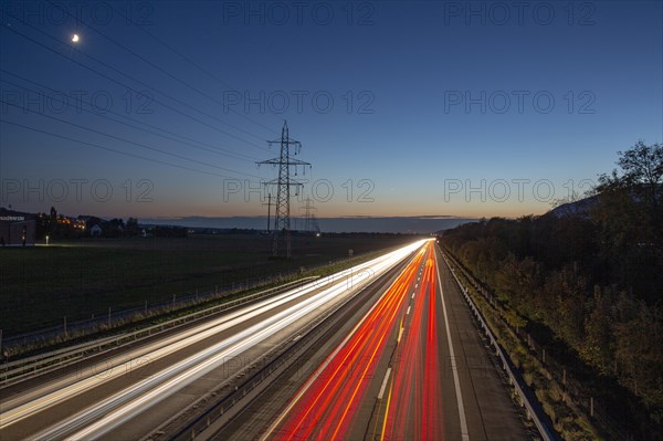 Road with light tracks at dusk
