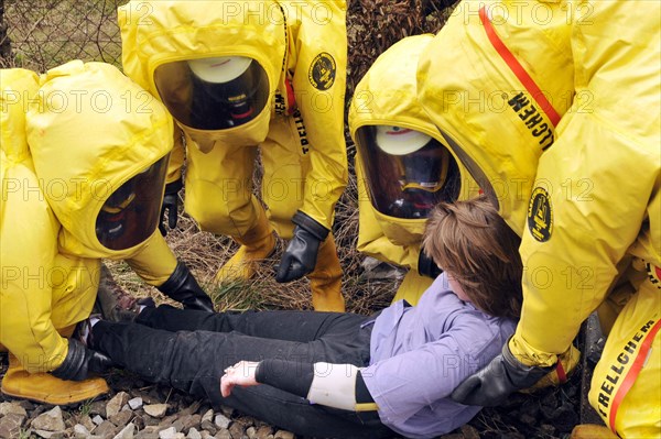 Firefighters in protective suits