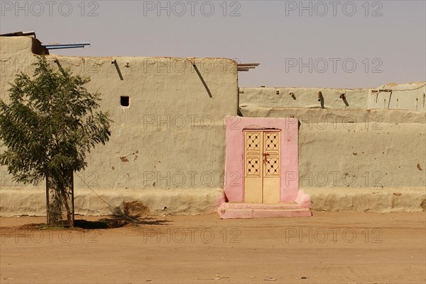 Pink door in village near Kerma