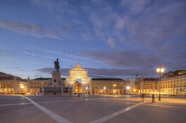 Arco da Vitoria and equestrian statue of King Jose I. at the Praca do Commercio at dusk