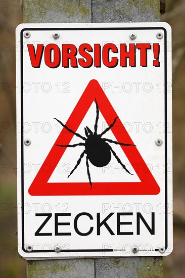 Warning sign Caution ticks