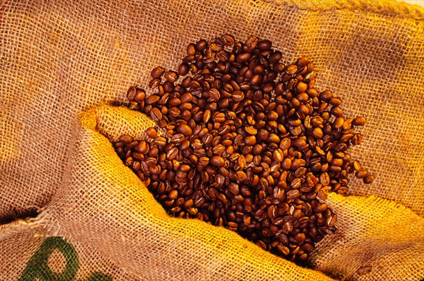 Roasted coffee beans on a jute sack