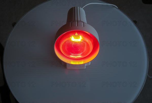 Luminous infrared lamp on the table