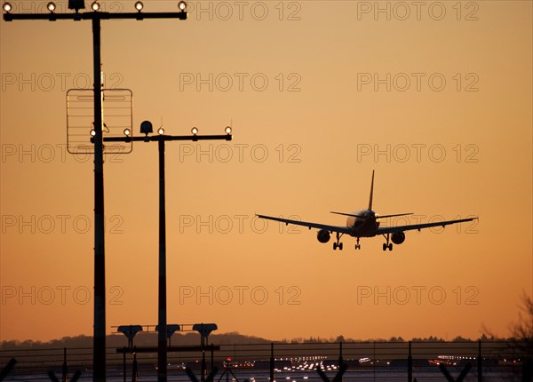 Approach aircraft at sunset